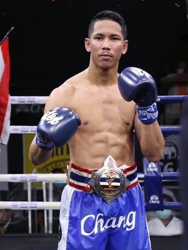 Kru Opp, former Thailand Muay Thai Champion and personal trainer at Matrix Gym Gold Coast, wearing his championship belt